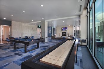Game room with pool table and shuffleboard